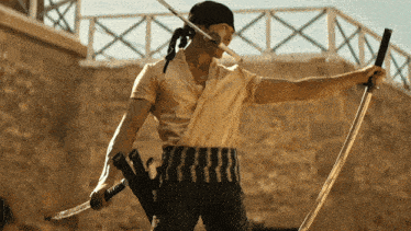 a man with a bandana on his head holds two swords