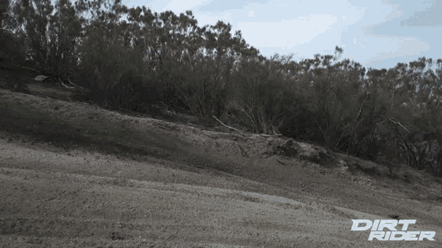 dirt rider is written on a dirt road