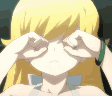 a girl with blonde hair is crying with her hands on her face
