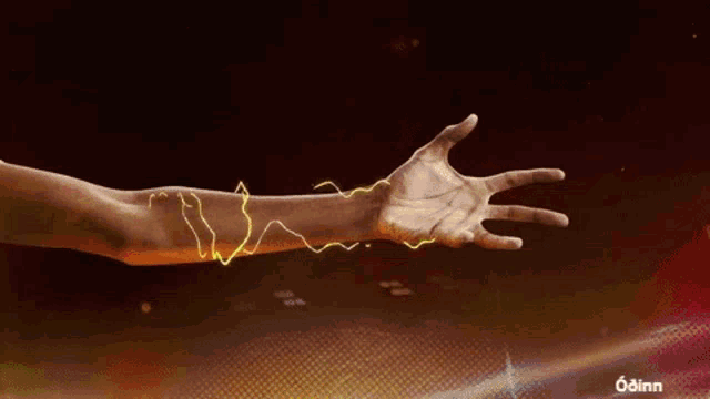 a close up of a person 's hand with a yellow lightning bolt coming out of it .