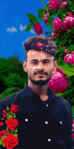 a man in a black shirt with red roses on his sleeve