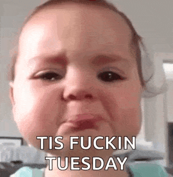 a baby is crying with the words `` tis fuckin tuesday '' written on it .