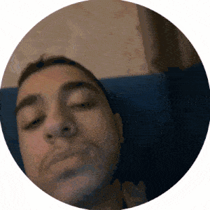 a close up of a man 's face with his eyes closed