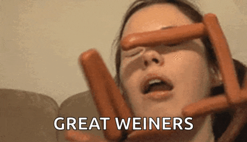 a woman is holding hot dogs in front of her face and the words great weiners are above her