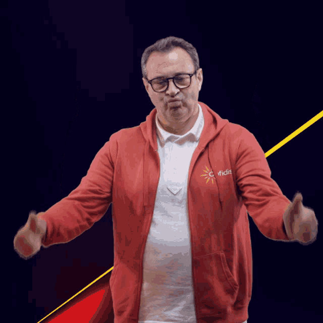 a man wearing a red sweatshirt that says ' confidence ' on it
