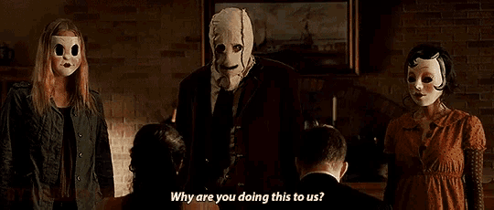 a woman with blood coming out of her face is talking to a man .
