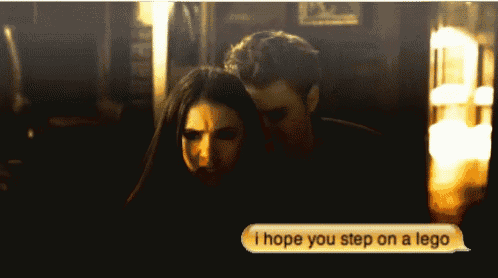 a man and a woman are sitting next to each other and a text says i hope you step on a lego