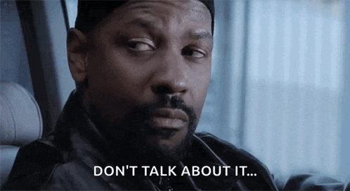 a man with a beard is sitting in a car and saying " don 't talk about it "