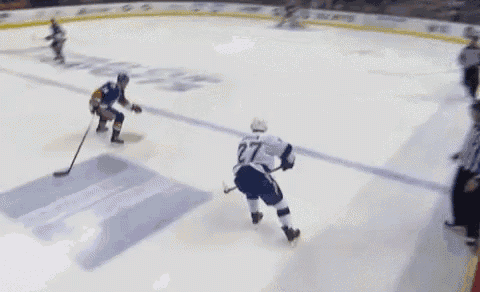 a hockey player in a white jersey with the number 27 on it