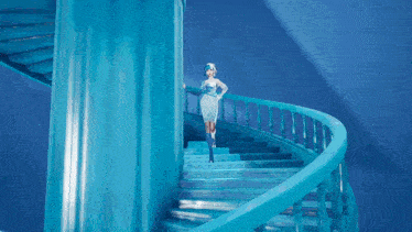 a woman in a white dress is walking down stairs