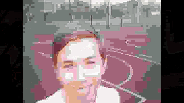 a pixelated image of a woman 's face with a gray background