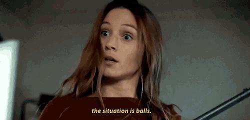 a woman says the situation is balls while holding a vacuum cleaner