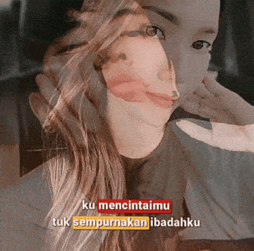 a double exposure of a woman 's face with the words ku mencintaimu tuk sempurnakan ibadahiku on the bottom