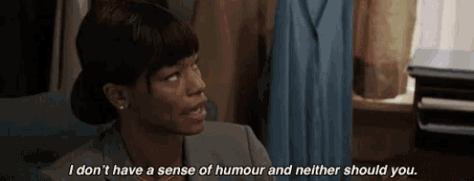 a woman in a suit is saying i don 't have a sense of humour and neither should you .