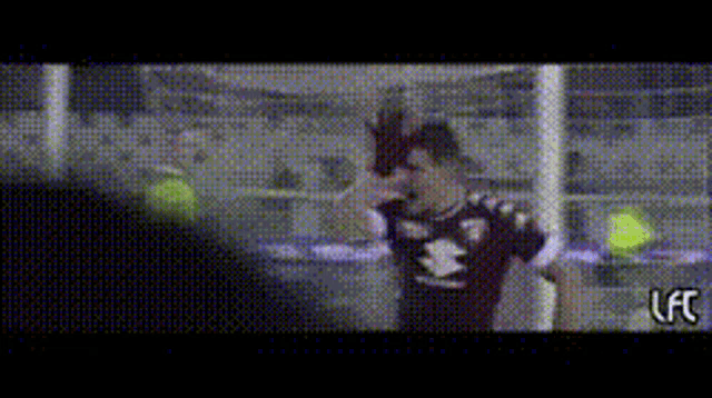 a blurry picture of a soccer player with the word lfc on the bottom right
