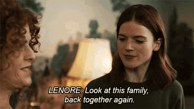 two women are looking at each other and one of them is saying leonore look at this family back together again