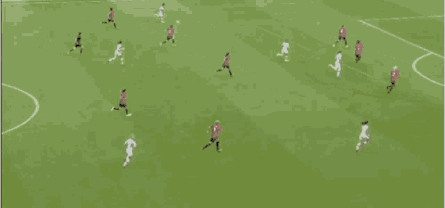 a group of soccer players are playing on a field sponsored by barclay 's bank