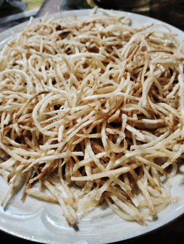 a close up of a plate of french fries