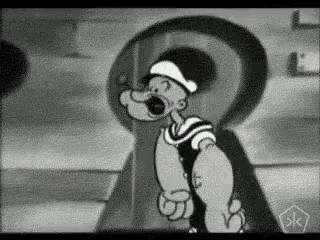 a black and white cartoon of popeye the sailor is standing in front of a large keyhole .