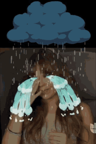 a woman is crying in front of a blue cloud