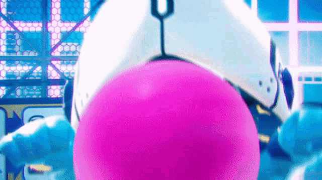 a close up of a robot 's face with a pink balloon in front of it .