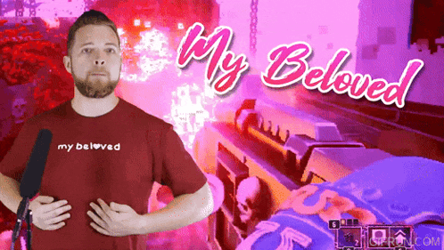 a man wearing a red shirt that says my beloved on it