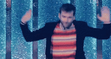a man in a suit and striped shirt is dancing in front of a pool .