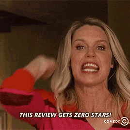 a woman is making a funny face and saying this review gets zero stars .
