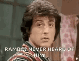 a close up of a man 's face with a caption that says `` rambo never heard of him ! ''
