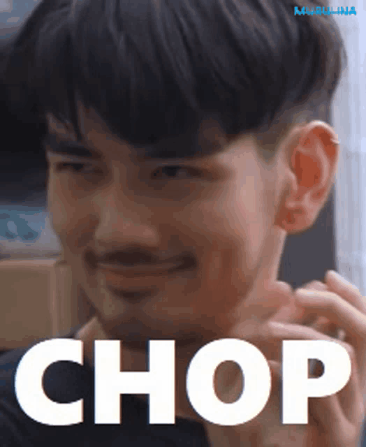 a close up of a man 's face with the word chop written on it