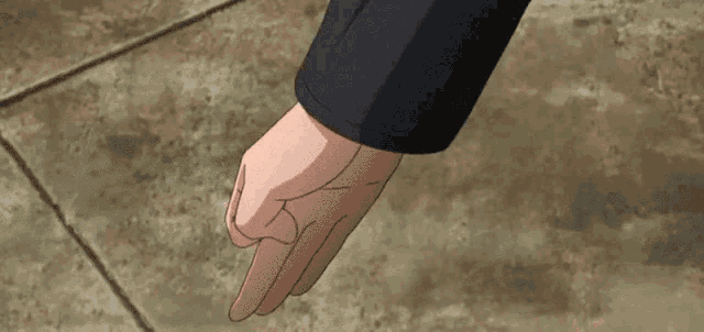 a person 's hand is reaching for a can of soda