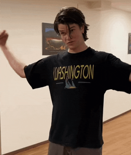 a young man wearing a black washington shirt