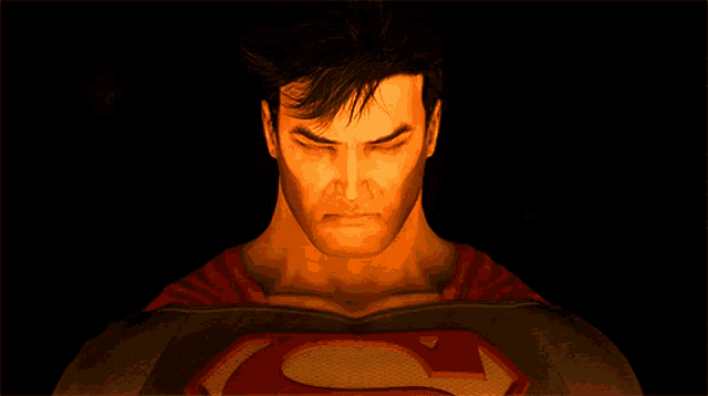 a close up of a man with red eyes and a red s on his chest