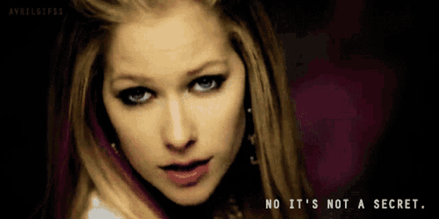 a close up of avril lavigne with the words no it 's not a secret below her