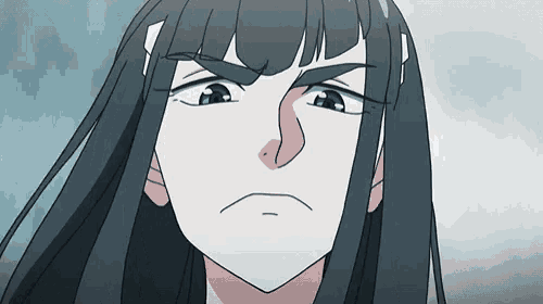 a close up of a cartoon character 's face with long hair making a funny face .