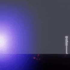 a purple light is shining on a gray background