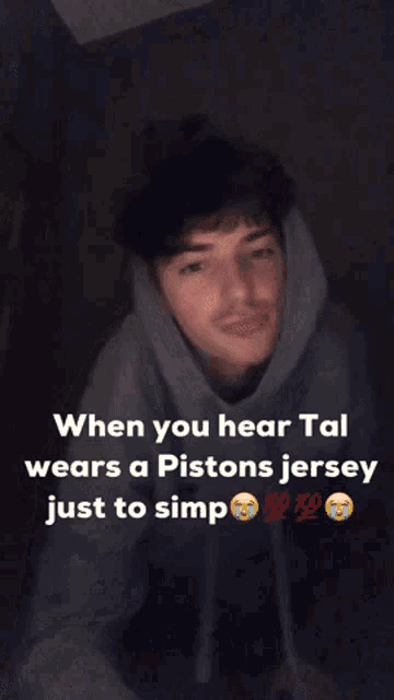 a young man wearing a pistons jersey with a caption