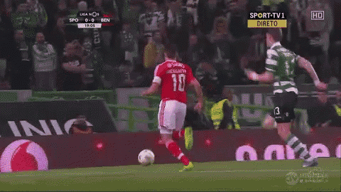 a soccer player with the number 10 on his jersey kicks the ball