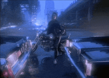 a man is riding a motorcycle on a street