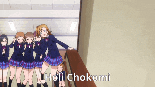 a group of anime girls are standing next to each other with the name holi chokomi on the bottom right