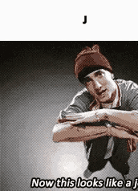 a man wearing a beanie is squatting down and says now this looks like a j.