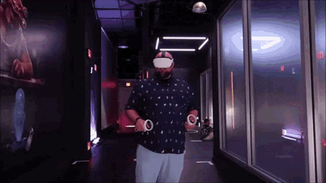 a man wearing a virtual reality headset walking down a hallway