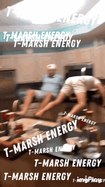 two men are sitting on a couch with the words t-marsh energy written on the bottom