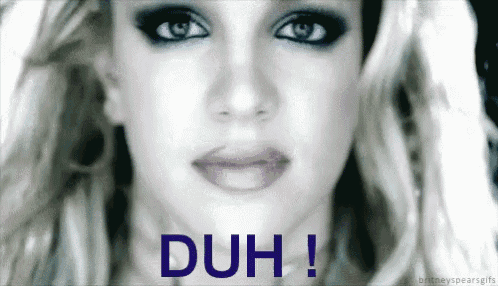 a close up of a woman 's face with the word duh written in blue