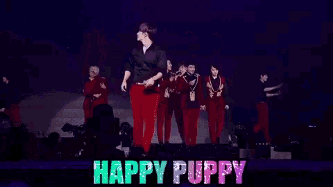 a man singing into a microphone with the words happy puppy written on the bottom