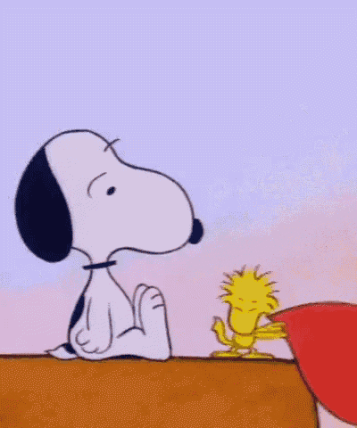 a cartoon of snoopy and woodstock sitting next to each other on a bench .