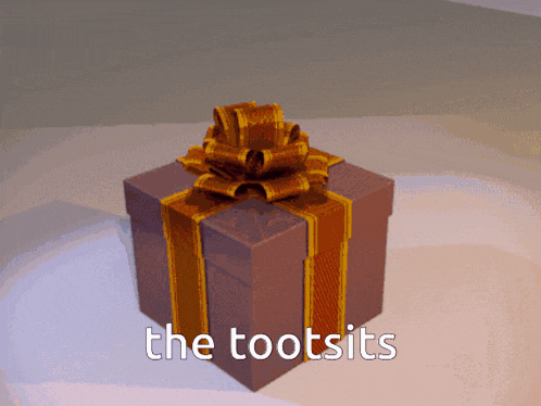 a gift box with a bow and the words the tootsits written on it