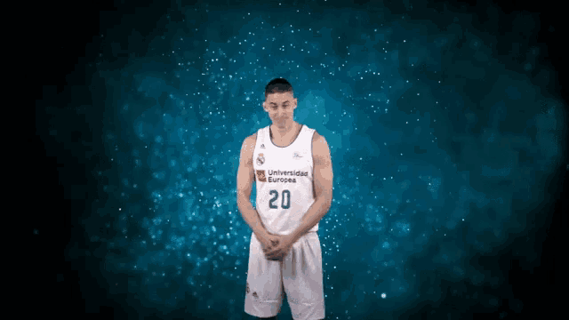 a basketball player wearing a jersey that says universidad europa 20