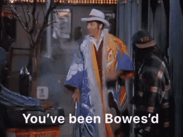 a man in a kimono and cowboy hat says you 've been bowes d