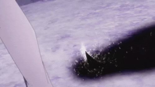 a person is holding a sword in the snow .